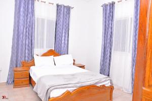 Postel nebo postele na pokoji v ubytování Kums Apartment