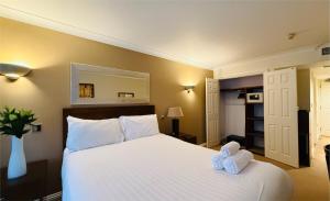 Hustyns Hotel客房内的一张或多张床位
