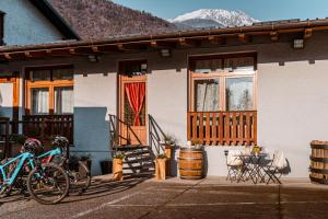 a house with two bikes parked outside of it at Dimora Perla di Villa - Historical Wine Retreat near Bernina Express in Villa di Tirano +31 photos