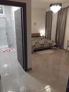 a bedroom with a bed and a large mirror at La sirena in Mazara del Vallo