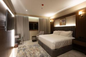 Postel nebo postele na pokoji v ubytování Doyof Hotel فندق ضيوف