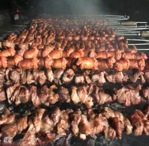 a bunch of meat cooking on a grill at Relais Masseria della Colomba - Agriturismo in Francavilla Fontana +35 photos