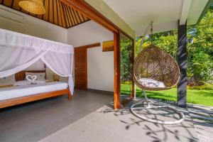 Rúm í herbergi á Coco Garden Pool Villas