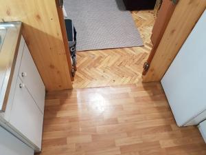 an overhead view of a room with a wooden floor at Ozon in Belgrade