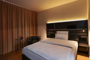 Postel nebo postele na pokoji v ubytování Best Western Plus Hotel Brueggen + 37 fotografií