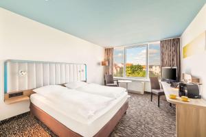 Postel nebo postele na pokoji v ubytování Best Western Plus Hotel Dresden City