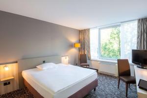 Postel nebo postele na pokoji v ubytování Best Western Plus Hotel Dresden City + 34 fotografií