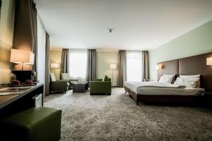 Postel nebo postele na pokoji v ubytování Hotel Jakob Regensburg DownTown, Best Western Signature Collection