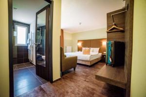 Postel nebo postele na pokoji v ubytování Hotel Jakob Regensburg DownTown, Best Western Signature Collection