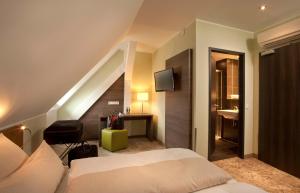 Postel nebo postele na pokoji v ubytování Hotel Jakob Regensburg DownTown, Best Western Signature Collection