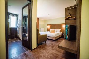Postel nebo postele na pokoji v ubytování Hotel Jakob Regensburg DownTown, Best Western Signature Collection