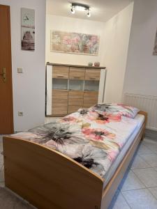 Cama o camas de una habitación en Ferienwohnung Am Berg
