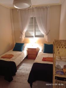 Postel nebo postele na pokoji v ubytování La Casa Roja