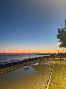 a puddle of water on the shore of a beach at Manzara Bungalow in Demre