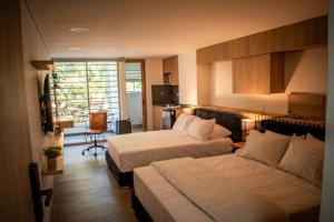 Postel nebo postele na pokoji v ubytování Edificio Atalanta en el corazón de Medellín