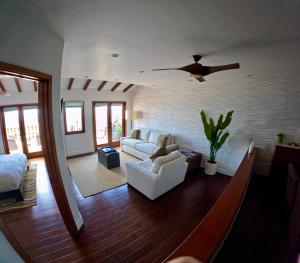 a living room with a bird flying through the air at Ocean View Retreat W Pool Access in Avalon