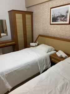 Postel nebo postele na pokoji v ubytování Agora Boutique Apart Hotel