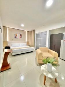 Postel nebo postele na pokoji v ubytování Hotel Suite Center Pereira