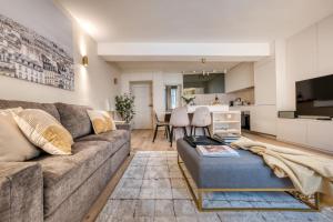 a living room with a couch and a table at Renovated Apartment Saint-Germain-des-Prés - Le Bon Marché in Paris