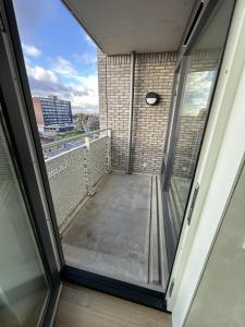 a view of a balcony from a window at Your perfect stay in Enschede! in Enschede