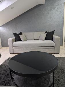a living room with a couch and a table at Top Belgrade Apartments in Belgrade +54 photos