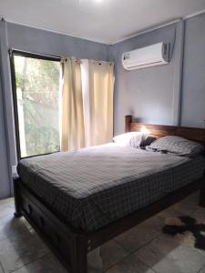 Ένα ή περισσότερα κρεβάτια σε δωμάτιο στο Playa Negra Apartments