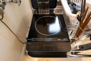 a black blender sitting on top of a counter at lol 3 101 in Hakodate