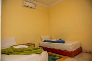 Postel nebo postele na pokoji v ubytování Afgo Hostel