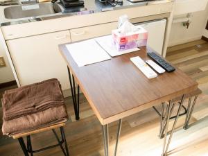 a table in a kitchen with a box on it at lol 3 201 in Hakodate