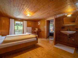 Rúm í herbergi á Ferienhaus Rinderer