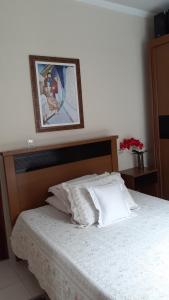 En eller flere senge i et værelse på Casa de Hospedagem Mirante Padre Leo