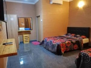 Katil atau katil-katil dalam bilik di Warisan Roomstay