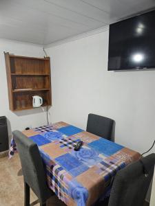 a room with a table with a table cloth on it at Navarro Apt 2 Ambientes in Navarro +7 photos