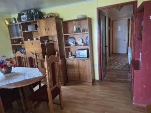 a room with a table and a dining room at Casa en Punta Arenas in Punta Arenas