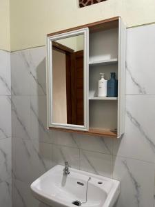 a bathroom with a sink and a mirror at Besakih villa in Besakih +31 photos
