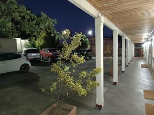 a parking lot at night with cars parked at Apart Hotel Croacia in Puerto Montt