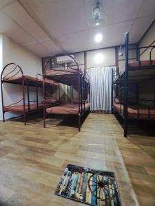 Postel nebo postele na pokoji v ubytování Benteng Taman Negara