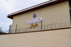 a sign on the side of a building at Oltotoi Suites in Nairobi