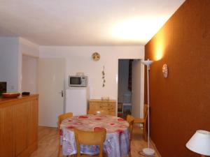 a kitchen with a table with a table cloth on it at Appartement T3 avec Balcon, 6 Couchages, Parking - FR-1-804-16 in Enchastrayes