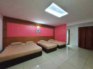 Letto o letti in una camera di Cool Point Hotel