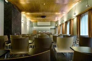 an empty dining room with tables and chairs at Hotel Il Cantico St. Peter in Rome