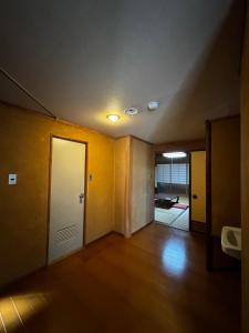 Postel nebo postele na pokoji v ubytování つるや旅館