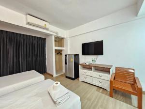 Postel nebo postele na pokoji v ubytování Crown BTS Nana Hotel