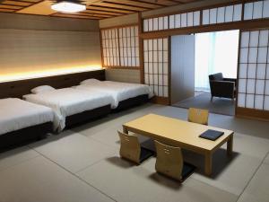 Manten no Tsujinoya客房内的一张或多张床位
