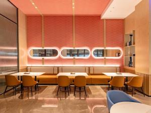 O zonă de relaxare la Echarm International Hotel Guangzhou Baiyun International Airport Qingbu Metro Station Branch - Free Deliver Service to Guangzhou Baiyun International Airport & Free Deliver Service to Canton Fair Complex During Canton Fair Period