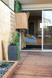 a bedroom with a bed and a balcony at Studio avec terrasse privative in Albi