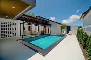 a swimming pool in the backyard of a house at Stay Pool Villa in Ao Nang Beach