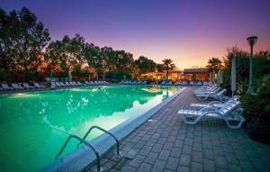 Φωτογραφία από το άλμπουμ του Feriendorf Le Tamerici Mobilehome Costa Rei für 6 Personen σε Marina di Cecina