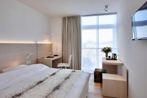 Ένα ή περισσότερα κρεβάτια σε δωμάτιο στο Parkhotel Izegem