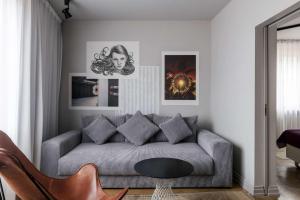 a living room with a couch and a table at Story Hotel Riddargatan, part of JdV by Hyatt in Stockholm